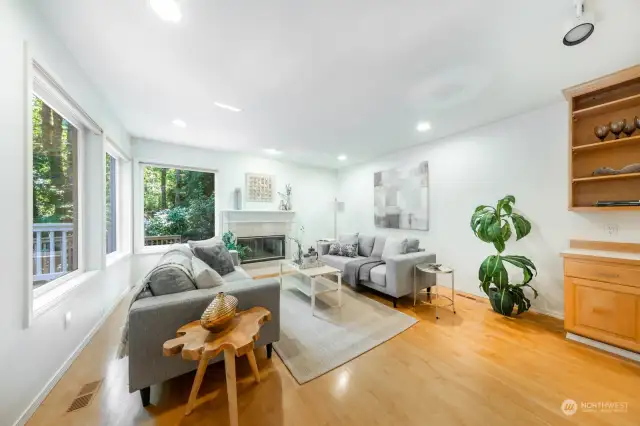 Room for a breakfast table in this space that transitions from the kitchen.  Built in desk and display cabinet