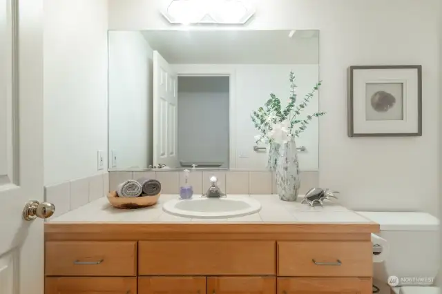 Powder room conveniently located in the main floor hallway.