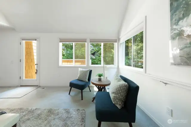 Sitting area in Primary bedroom with access to private deck.