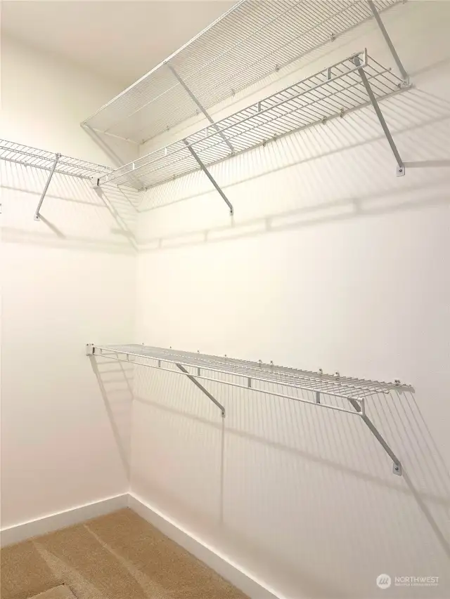 The spacious walk-in closet in the primary bedroom.