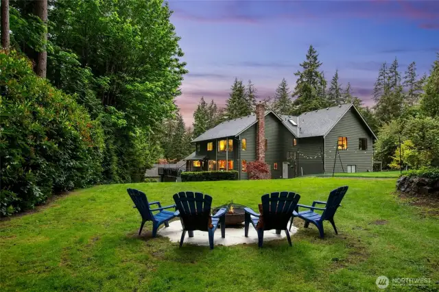 The setting is amazing on a shy horse acre with a putting green, fire pit, sport court and detached 2-car shop/garage with loft.