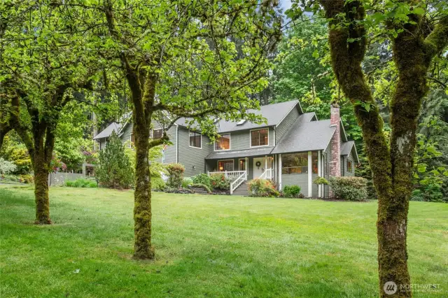 Picture perfect with bountiful fruit trees to enjoy all summer long.