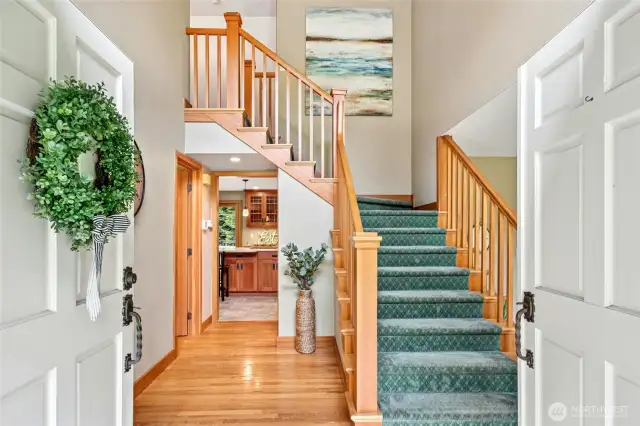 Come on in! Real hardwood floors greet you. Dual staircases in the home.