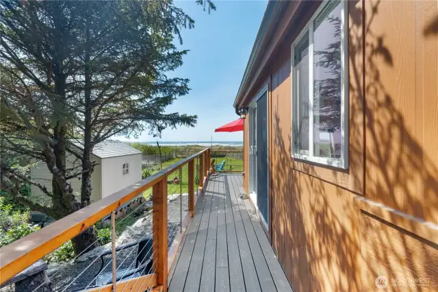 Custom deck wraps around side of home
