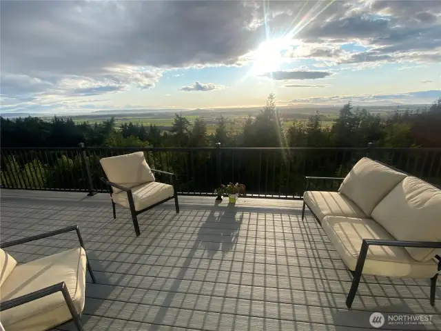 Over 1,000 square feet of decking on two levels and a staircase down to the ground from the lower level and parking area.