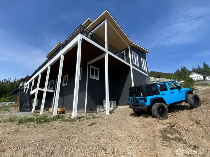 The builder is considering bringing in more fill dirt to allow for cars to more easily turn around here.