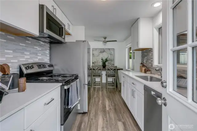 Beautiful kitchen littered with upgrades and quartz countertops
