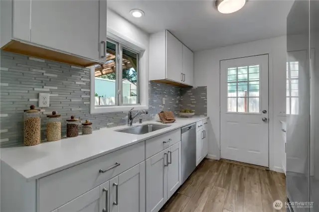 Spacious Kitchen leads to back patio