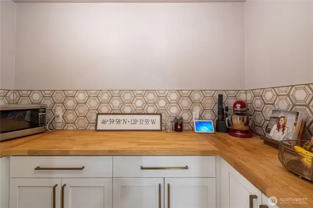 Butler's pantry with tons of outlets, butcher block countertop and tons of storage.