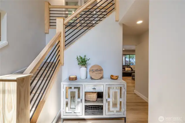 The gorgeous designer pine railing with iron Spindles Create the perfect ambiance as you enter the home