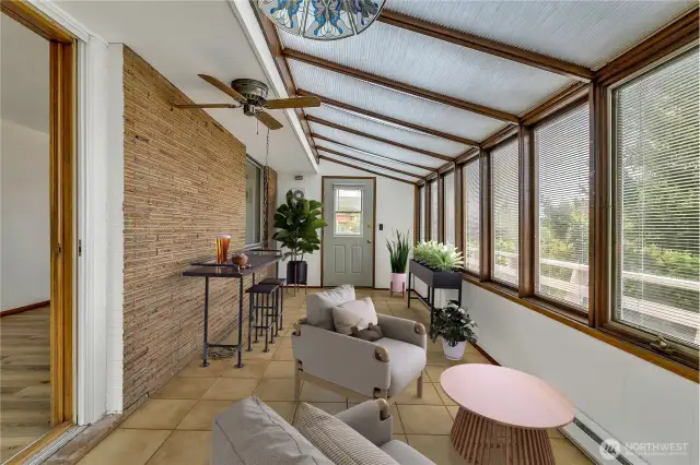 Views of the Olympics and Sound from the fully enclosed sunporch.