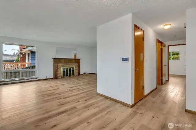 Looking back into the living room. Hall on the left leads to bedrooms and main level full bath.