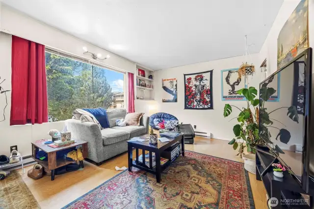 Main house living area.  Light and airy with easy care laminate flooring.