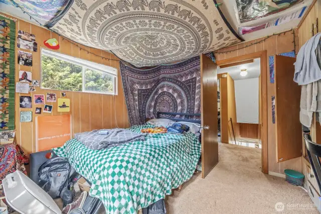 3rd bedroom on upper level of house; nice built in for storage.