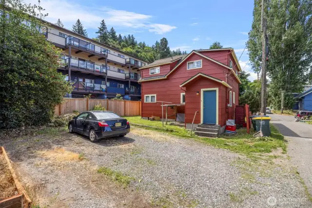 Parking area between house and duplex.