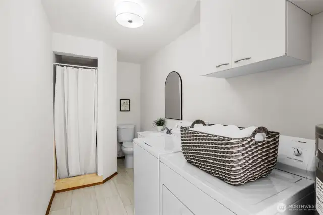 Large 3/4 bath + laundry room.  New Hot water heater, toilet, sink, faucet, mirror and lighting