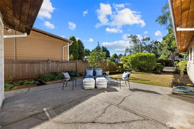 Outdoor Living at Its Best - room to roam and create  The private patio and thoughtfully landscaped garden areas offer a quiet escape—whether you're gardening, dining al fresco, or just unwinding in the fresh air.