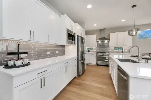 gorgeous kitchen with large island, pull out trash drawer, lots of cabinet & storage space