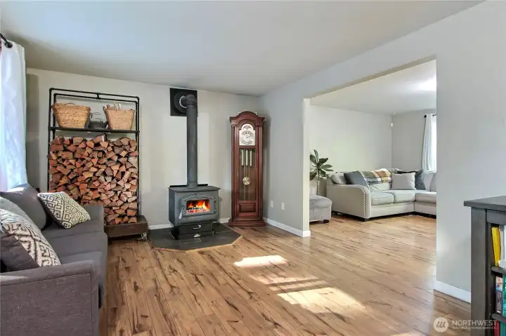 As you enter the home, on your left you will find your family room with wonderful wood stove to keep you warm on cooler nights.