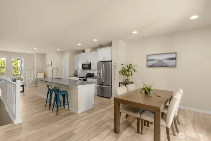 Dining room sits just off the kitchen, perfectly placed for easy meals and effortless entertaining, with seamless access to the patio for indoor-outdoor gatherings.