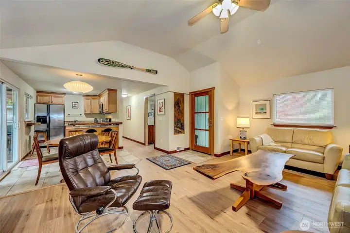 Grand Cathedral Ceilings w/Tiled Entry, Engineered Hardwoods, And Ceiling Fan.