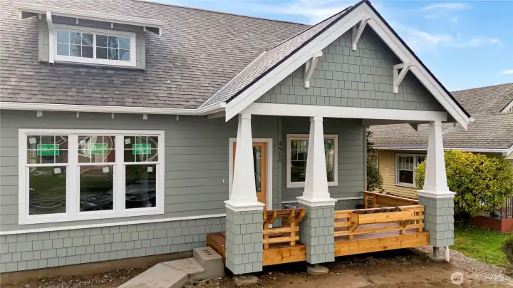 Unit A is the single family home with covered deck complete with flower boxes & built-in seating bench.