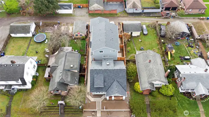 Plat includes 3 units - single family home & 2 townhomes with detached garage and parking spaces off the alley.