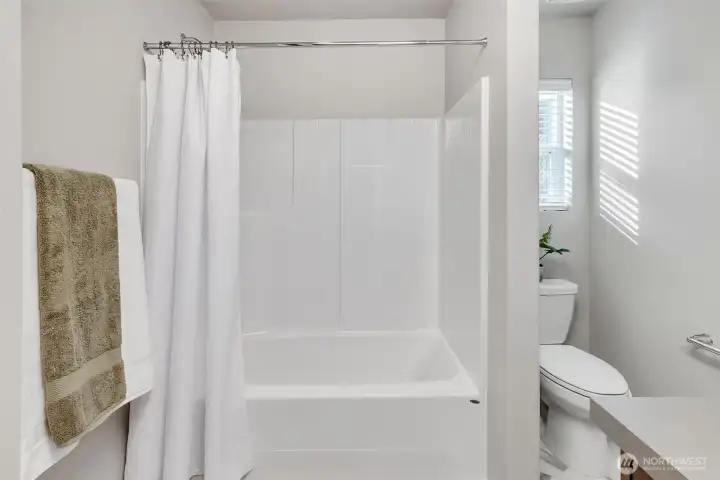 Second floor hall bathroom with deep tub.