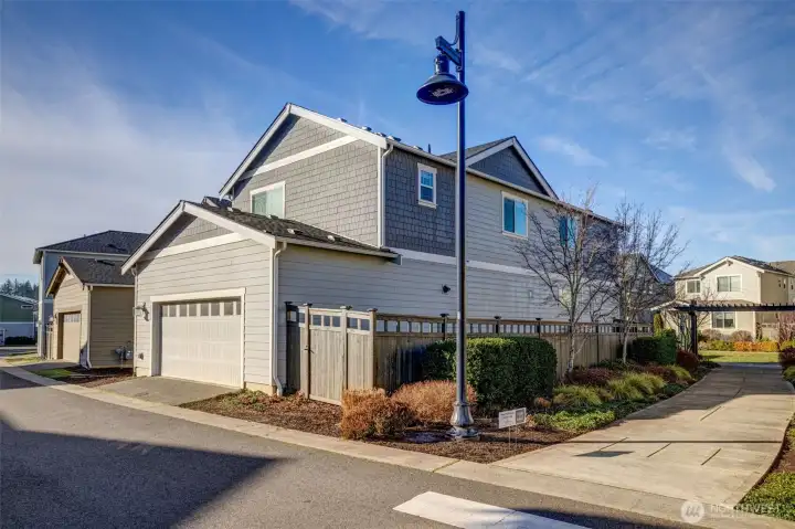 GPS will bring you to garage. Park in front of garage door and enter in front.