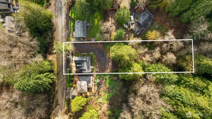 Tucked onto nearly a half-acre, the setting is remarkably private and serene, surrounded by nature and designed for those who crave both beauty and breathing room.