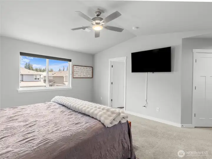 Second view of the primary bedroom. Door to the left leads to your ensuite bath, small secondary closet shown on the right at the entrance of the room.