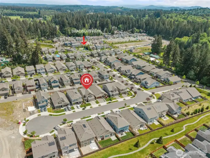 This aerial perspective clearly shows the home's sought-after position on Wyatt Ct SE, tucked on a quiet cul-de-sac that provides reduced through-traffic and added privacy. Bradbury Park is visible nearby, making this an ideal location for an active outdoor lifestyle.
