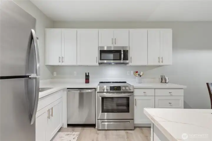 Gorgeous new white shaker cabinets in your updated kitchen.