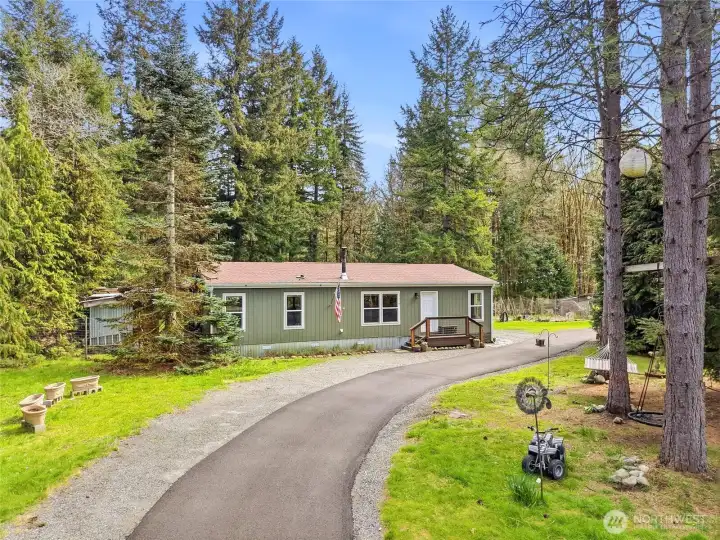 Welcome Home to your private 6.4 acres with easy access circular driveway.