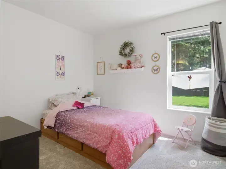 Bedroom #2.  Nice natural ligh.t with views of the backyard