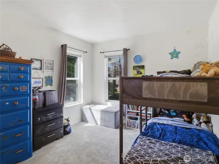 Bedroom #3. With two windows looking out into the peaceful yard.