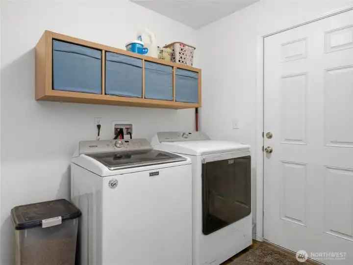 Laundry room with access to the back porch.