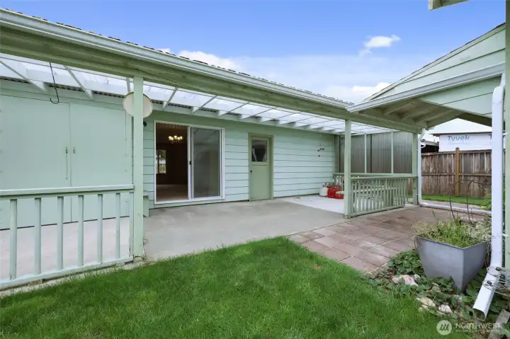 Covered back patio for barbeques rain or shine.