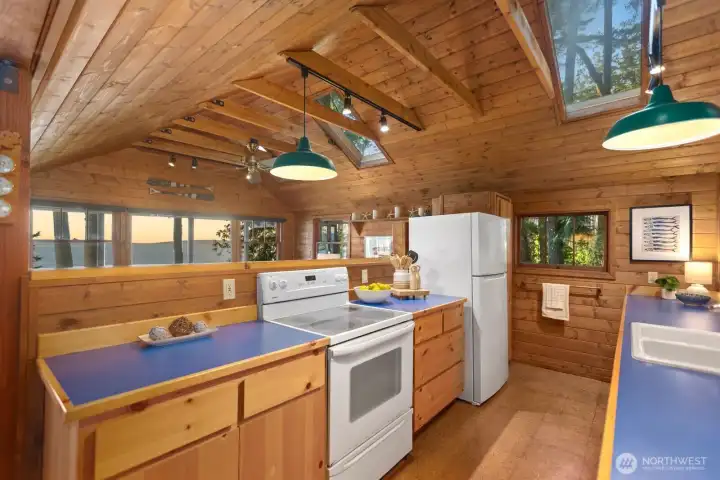 Skylights emphasize the beauty of the surrounding forest. Skylights emphasize the beauty of the surrounding forest.