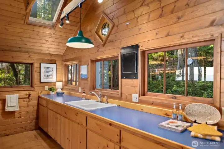 Huge picture windows in every direction flood the cabin with natural light. Huge picture windows in every direction flood the cabin with natural light.