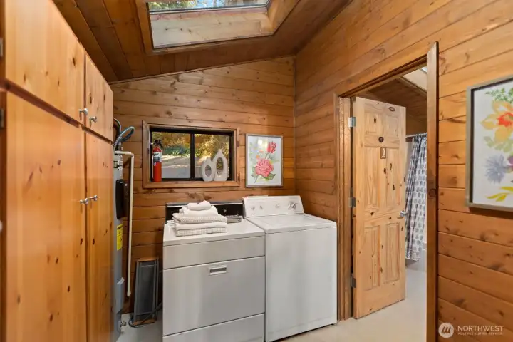 A large laundry room with plenty of storage space. A large laundry room with plenty of storage space.