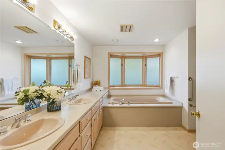 Primary bathroom with separate tub and shower.