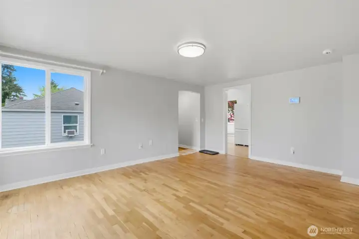 Entry into living space and kitchen through the doorway on the right