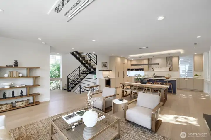 A gorgeous living room, notice the dual stringer stairs in the background.