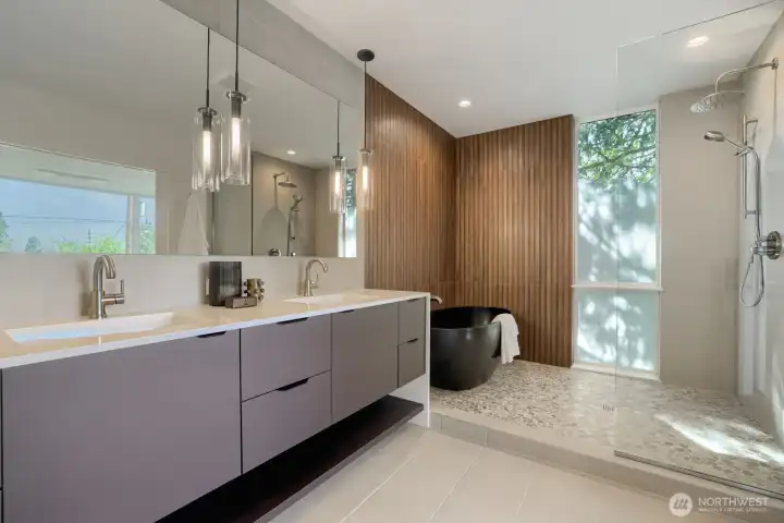 A spa-inspired bathroom with quartz soaking tub and designer tile.