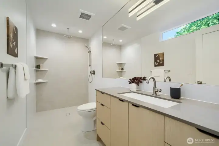 An ADA-inspired main floor with a roll-in shower, wide doorways.