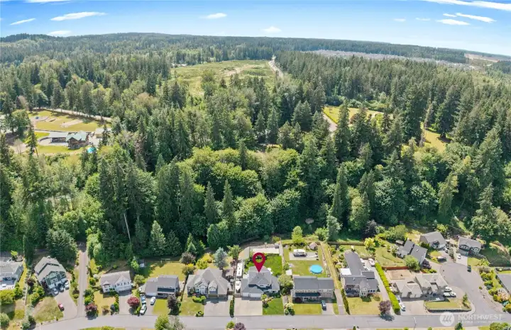 Perched high above the valley in one of Orting’s most exclusive gated communities, this extraordinary estate offers a rare blend of luxury, privacy, and commanding territorial views.