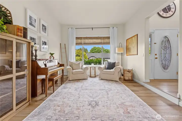 Sunken Living Room with Laminate Hardwood Floors and Large Picture Window
