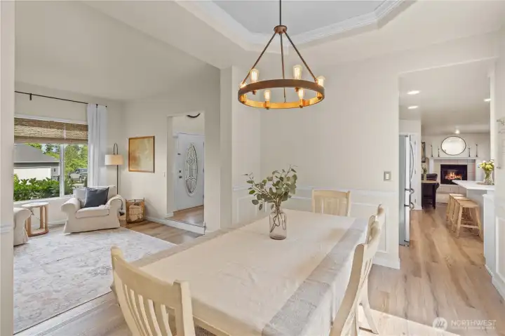 Dining Room with Wainscotting, Tray Ceiling with Crown Molding.