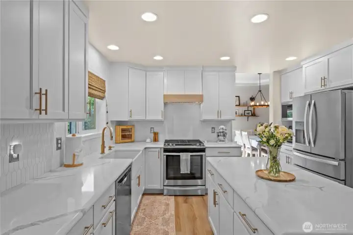 Gorgeous Brand New Kitchen w/ White Cabinetry, Exquisite Quartz Counters, Farmhouse Sink, Gas Range, Bronze Hardware.